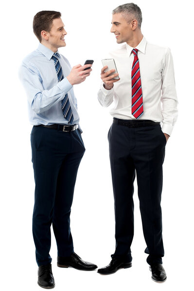 Male executives sharing their contacts