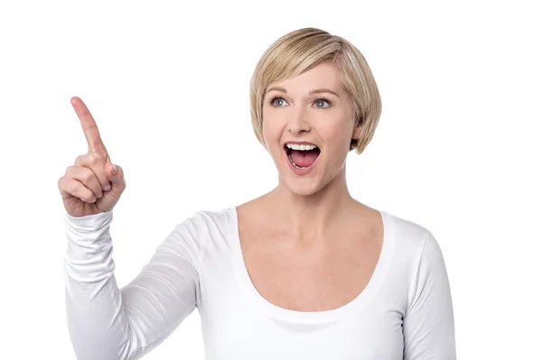 Woman pointing finger to upwards — Stock Photo, Image