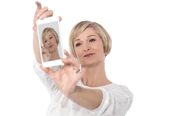 Woman taking selfie with smartphone — Stock Photo, Image