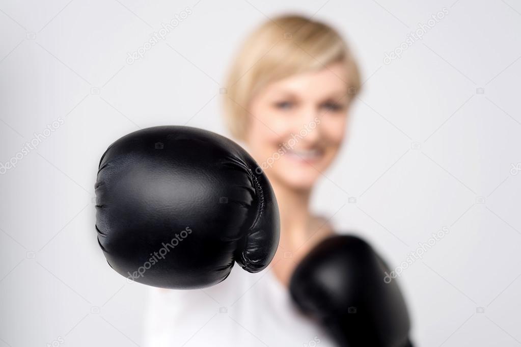 Woman with black boxing gloves