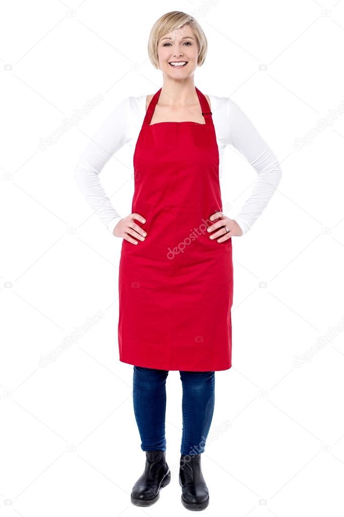 Woman chef with hands on waist