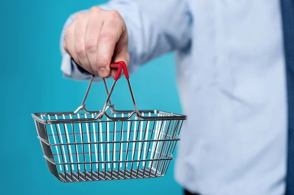 Male executive showing shopping cart. — Stock Photo, Image