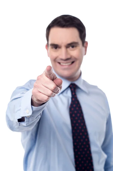 Businessman pointing towards camera — Stock Photo, Image