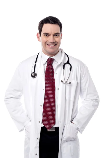 Doctor with hands in his overcoat — Stock Photo, Image