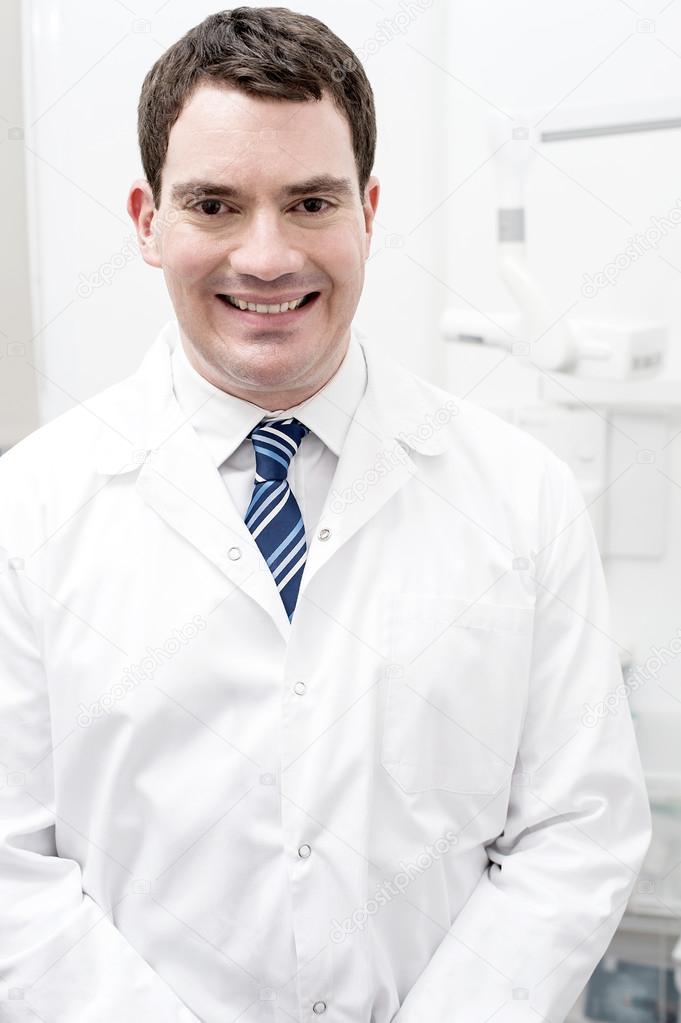 Dentist posing at dental office