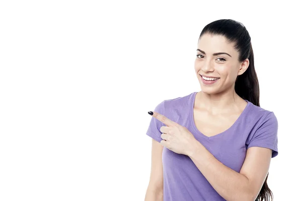 Woman pointing at copy space — Stock Photo, Image