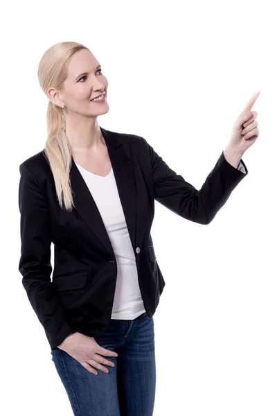 Businesswoman pointing at copyspace — Stock Photo, Image