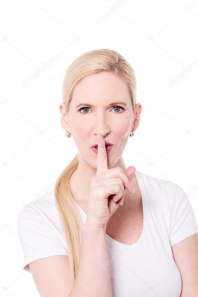 Woman keeping finger on her lips