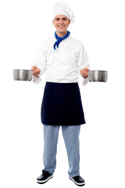Male chef holding empty vessels — Stock Photo, Image