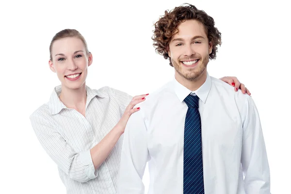 Businesswoman posing behind her colleague — Stock Photo, Image