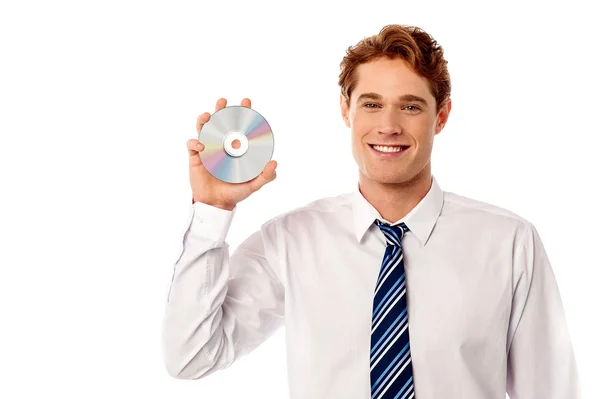 Sales executive showing a new cd — Stock Photo, Image