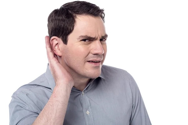 Man holds his hand near ear — Stock Photo, Image