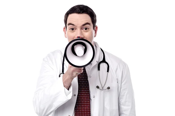 Physician proclaiming into megaphone — Stock Photo, Image