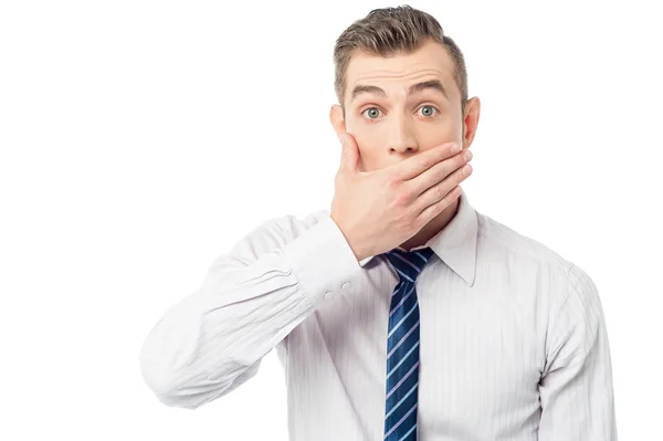 Corporate man covering his mouth — Stock Photo, Image