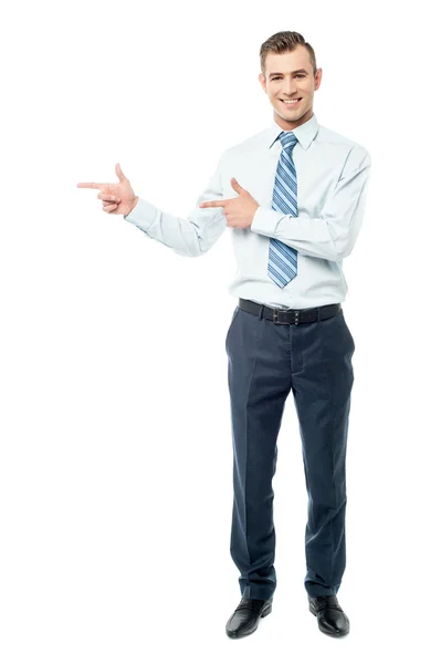 Male executive pointing away — Stock Photo, Image