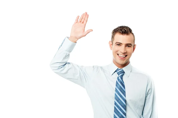 Handsome corporate man waving hand — Stock Photo, Image