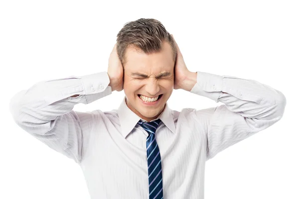 Businessman covering his ears with hands — Stock Photo, Image