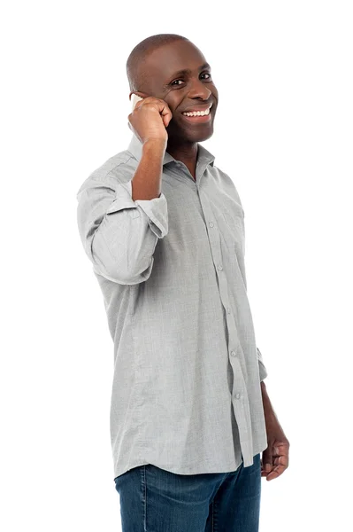 Handsome man talking on cell phone — Stock Photo, Image