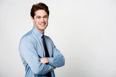 male executive posing with crossed arms
