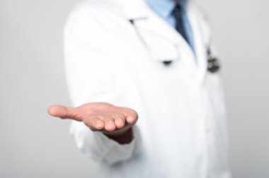 male doctor shows empty palm
