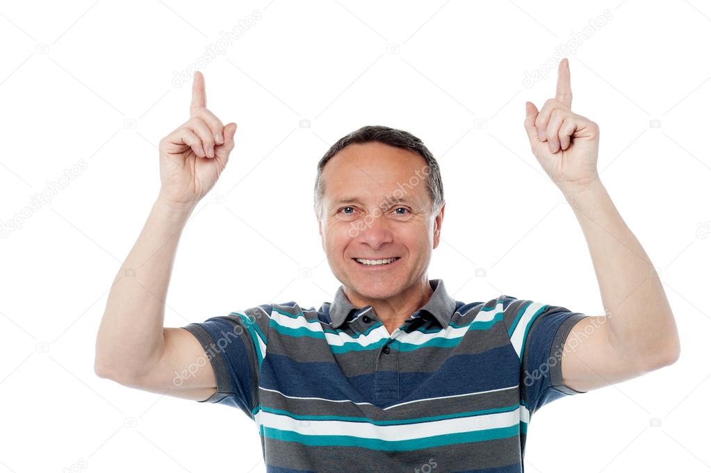 man pointing his fingers upwards