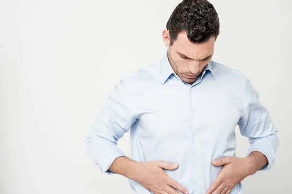 Man with strong stomach pain — Stock Photo, Image