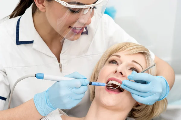 Woman under a dental treatment. — Stok fotoğraf
