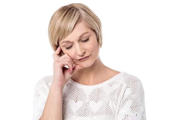 Thoughtful middle-aged woman — Stock Photo, Image