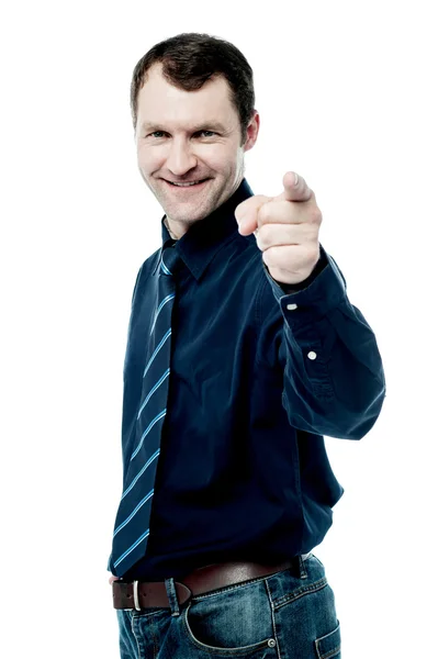 Corporate man pointing towards camera Stock Picture