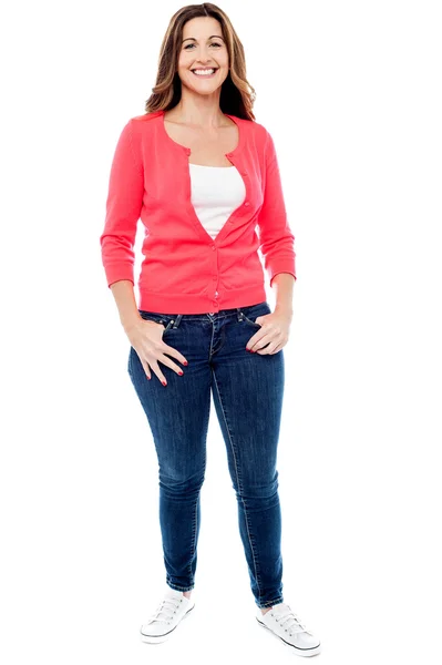 Middle aged woman with hands in pockets — Stock Photo, Image