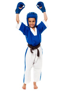 karate girl showing her success clipart