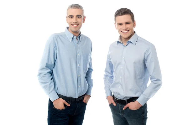 Young friends with hands in pockets — Stock Photo, Image