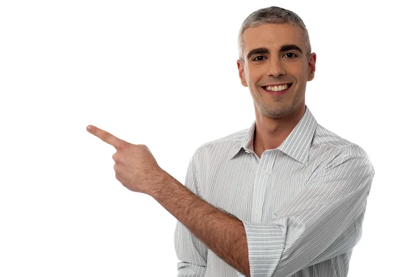 Man pointing to copy space — Stock Photo, Image