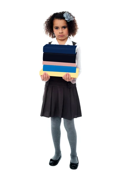 Girl holding stack of school books — Stock Photo, Image