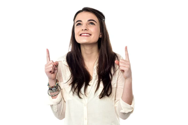 Teen girl pointing her fingers up — Stock Photo, Image