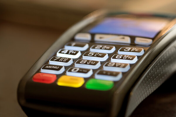 credit card machine on table