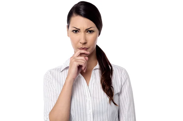 Woman with hand on her chin — Stock Photo, Image