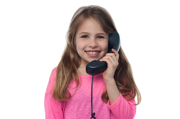 Little girl talking on retro telephone — Stock Photo, Image