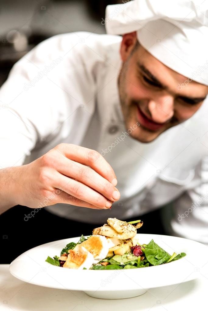 chef garnishing a salad