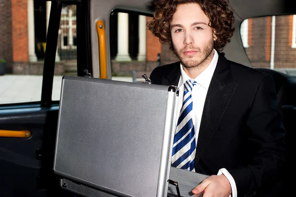 Young businessman with suitcase — Stock Photo, Image