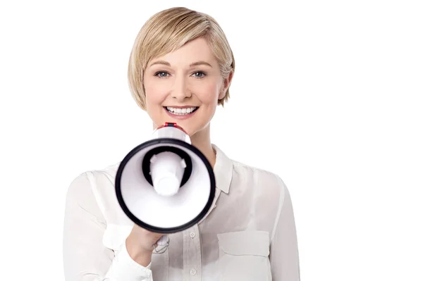 Woman making announcement via loudspeaker — Zdjęcie stockowe