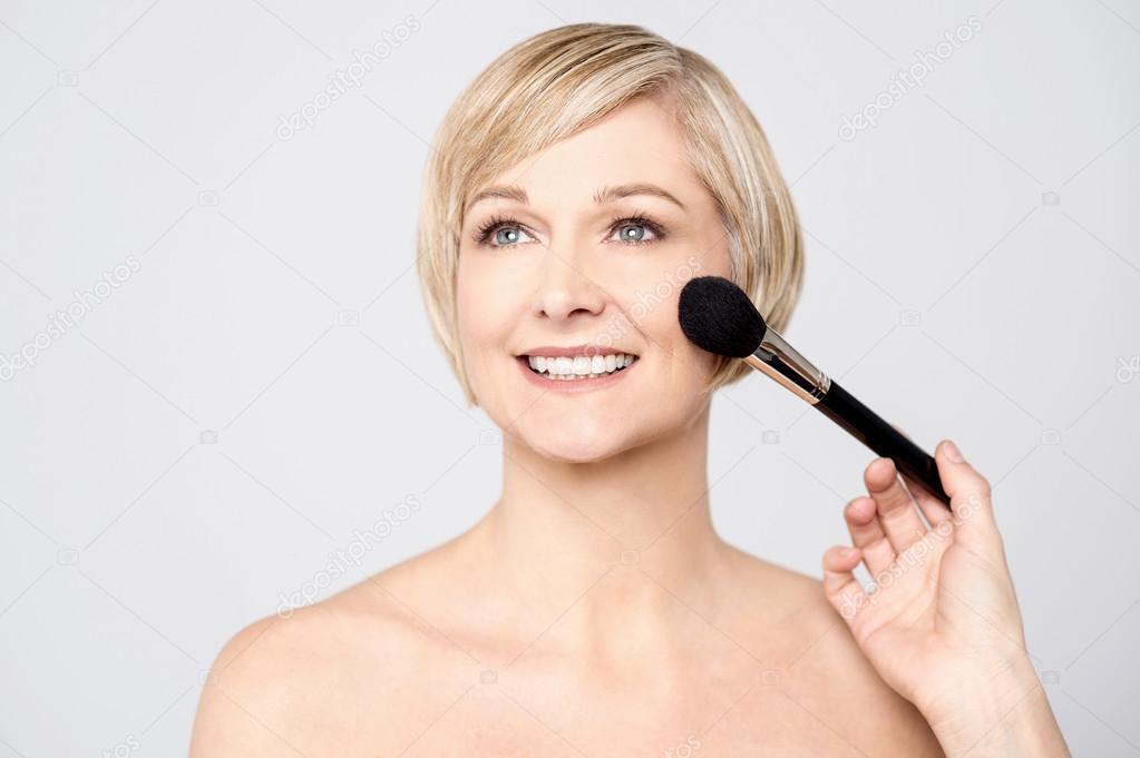 woman getting makeup