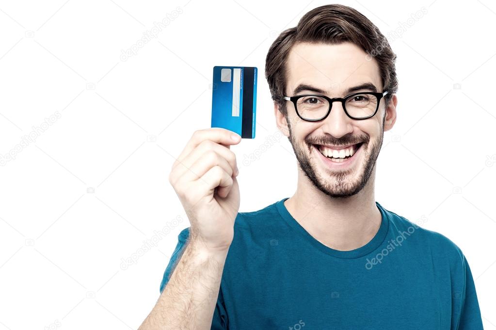 young guy holding credit card