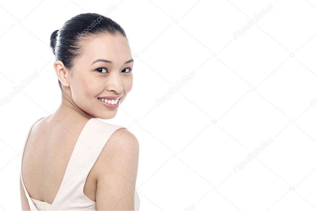 woman looking over her shoulder