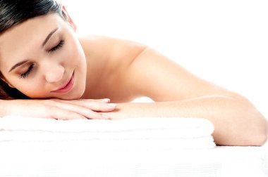 woman enjoying her spa treatment clipart