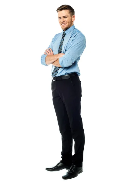 Smart smiling businessman with arms crossed — Stock Photo, Image