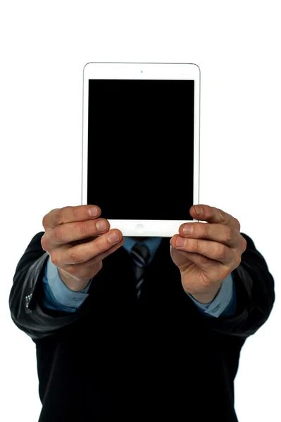Businessman displaying new tablet to camera — Stock Photo, Image