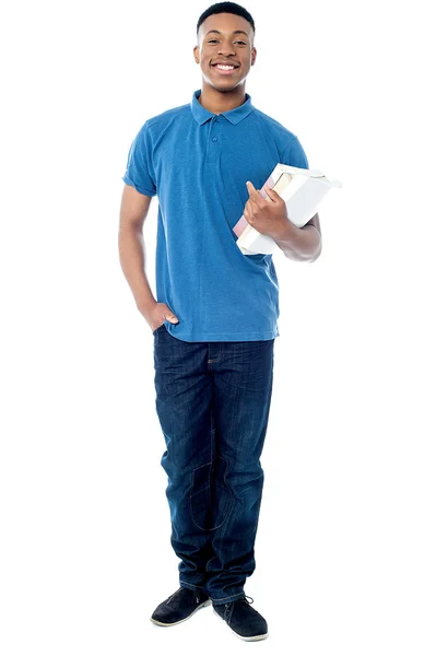 Estudante sorrindo posando com livros — Fotografia de Stock