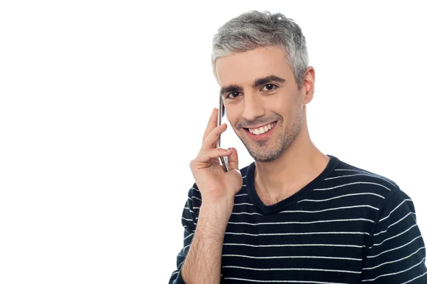 Handsome man talking on the cell phone — Stock Photo, Image