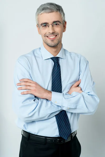 Young employee with his arms crossed — Stock Photo, Image